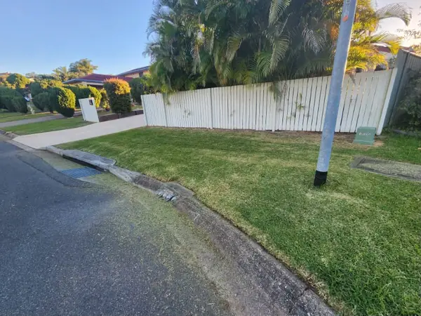 Corner block nature strip mown and edged along the footpath