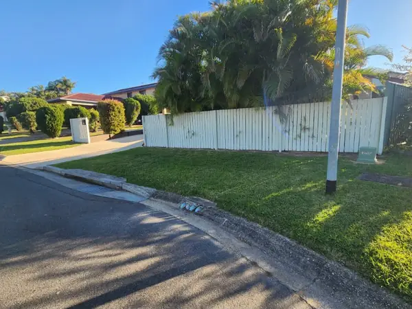 Street frontage lawn mown clean from fence line to kerb